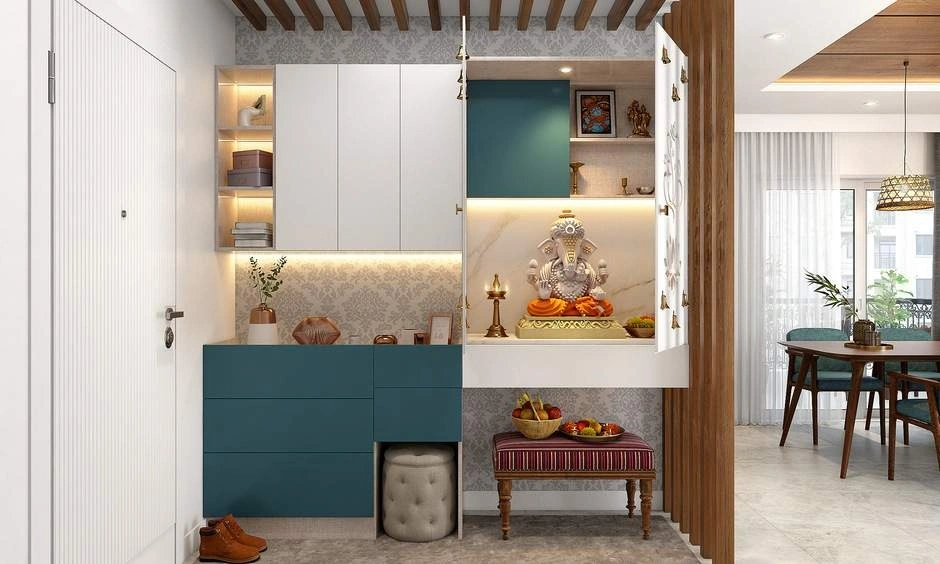 Modern pooja room layout concealed within an elegant wooden cabinet unit near the home entrance.