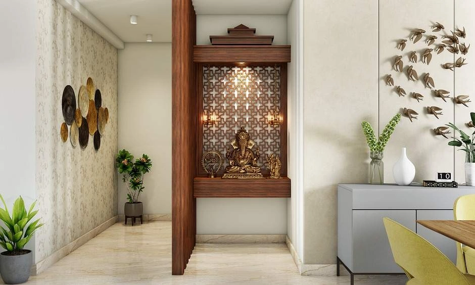 Space-saving small pooja room layout installed in an unutilised corner with a wall-mounted wooden mandir unit.