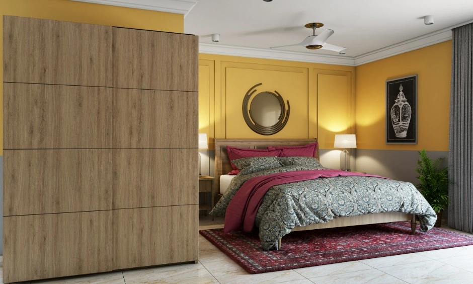 A handleless wardrobe provides streamlined storage while keeping the bedroom uncluttered.