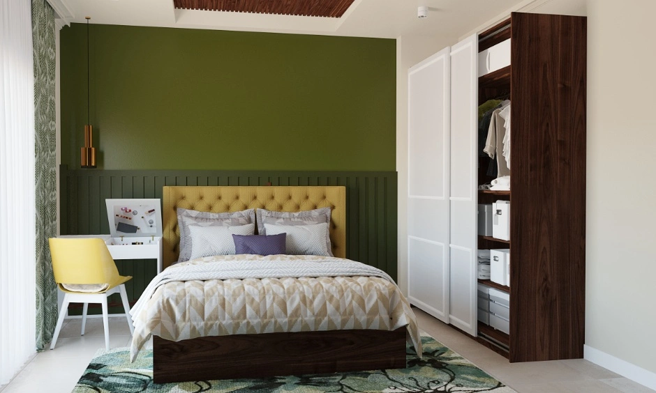Delhi bedroom refreshed with green wall panelling and updated storage.
