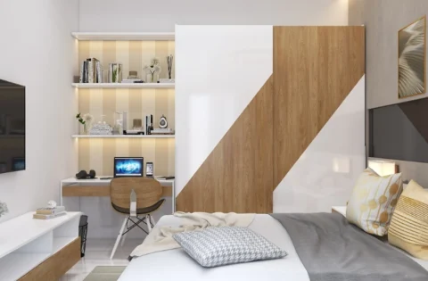 A contemporary Kolkata bedroom combines a strong bed wall, daylight and a slim desk