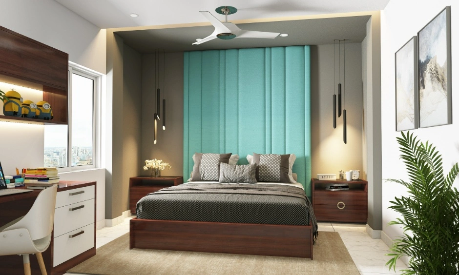 A bold headboard and compact study corner shape the bedroom.