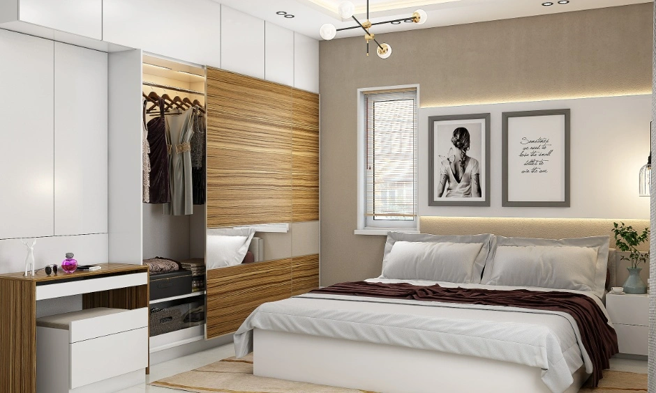 Integrated furniture keeps storage and dressing within one compact bedroom wall.