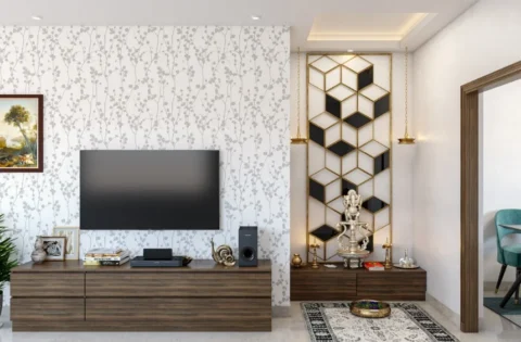 Pooja room layout with a geometric gold-framed backdrop and floating platform beside a TV unit in a living room.