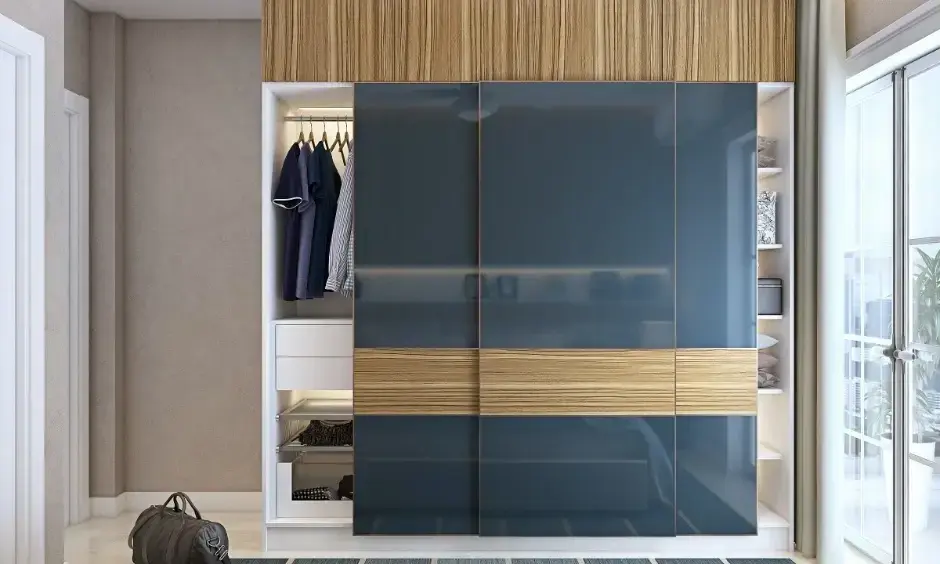 A spacious bedroom features a large wardrobe with mirrored panels and warm wood finishes.