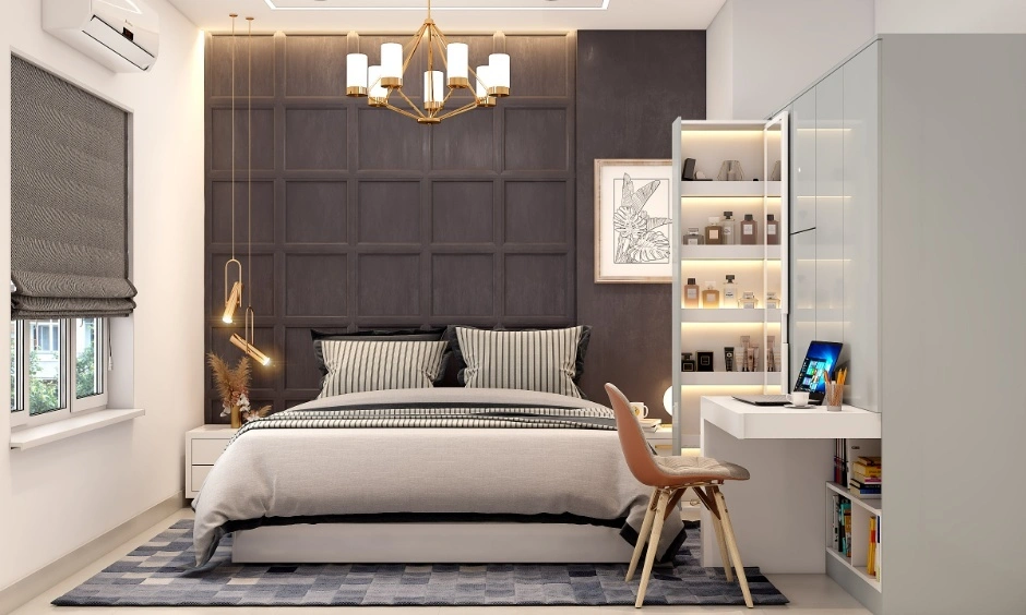 A blue sliding wardrobe provides organised storage while saving space from hinged shutters