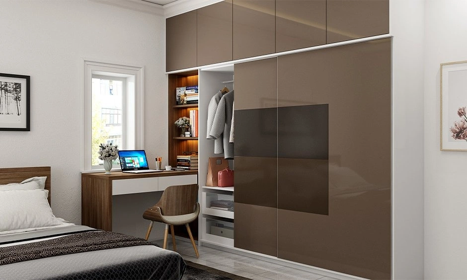 A dark bedroom features a wooden bed with integrated bedside storage and warm lighting.