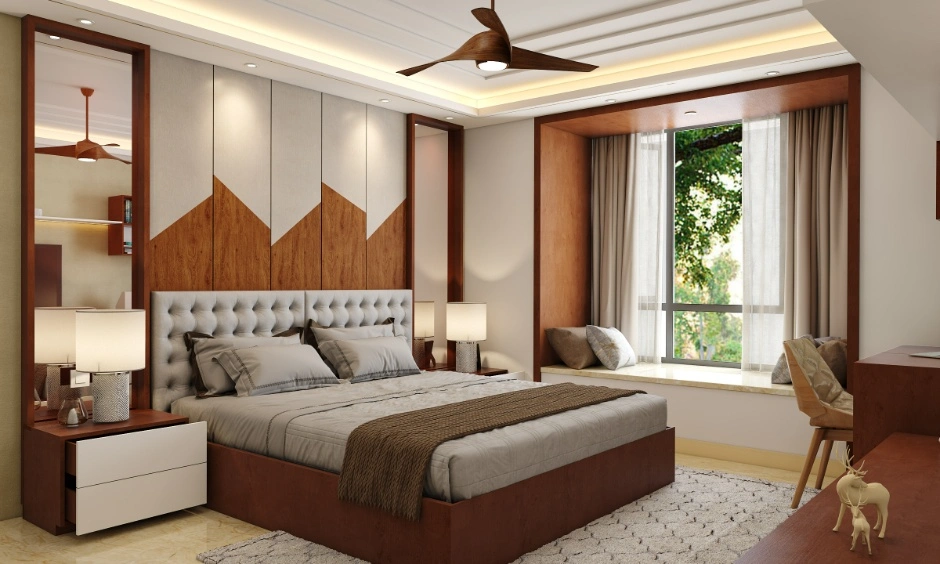 Contemporary bedroom with a wood-panel headboard, neutral furnishings and layered ceiling lighting.