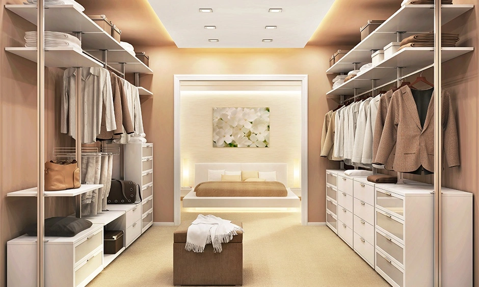 Bedroom with extensive built-in wardrobes surrounding the bed and limited open wall space.