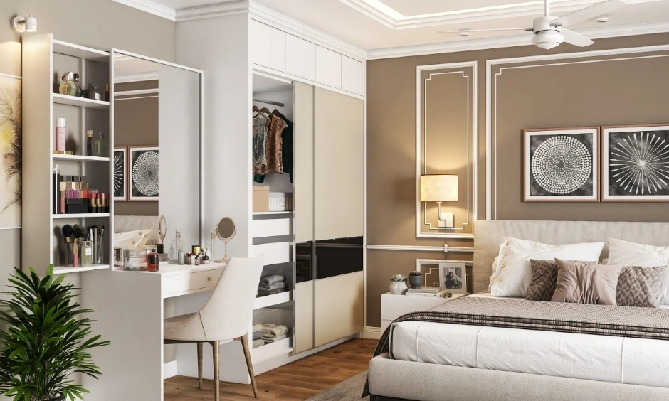 Sliding wardrobes with integrated vanity maximise storage in this Ahmedabad bedroom