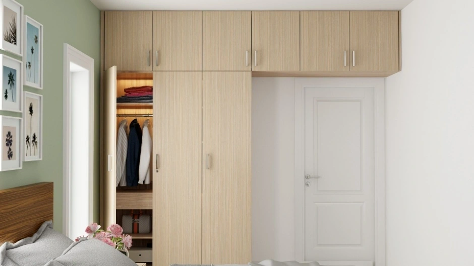 BWR-grade plywood wardrobes with a laminated finish create a premium bedroom interior.