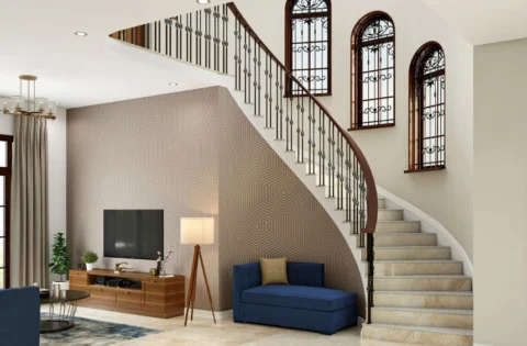 A modern living room with a striking staircase and elegant contemporary interiors.