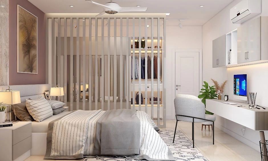 Wooden alternating partition separates the bed from a walk-in wardrobe in this modern bedroom.