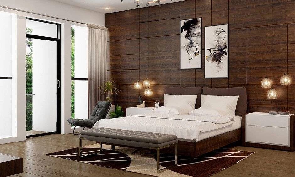 Warm wood finishes, neutral walls and simple furniture create a calm minimalist bedroom.