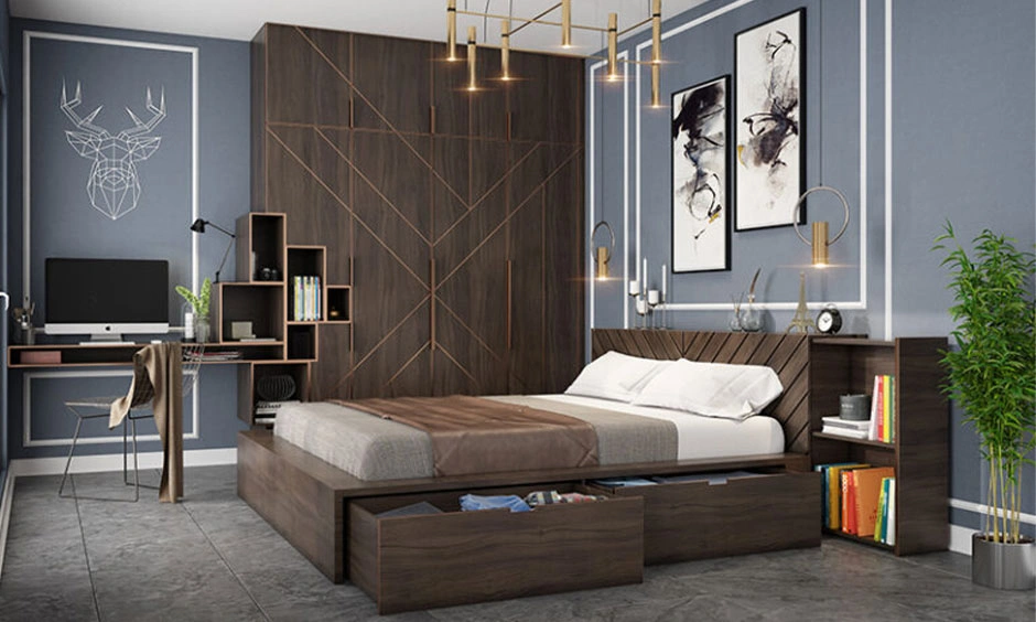 A wooden desk is integrated into the bedroom wardrobe with additional overhead storage.