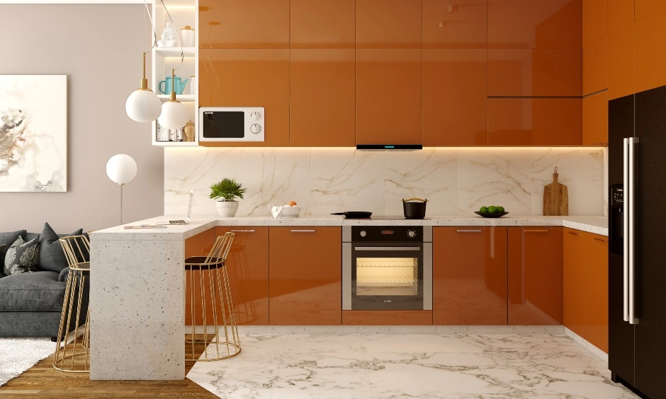 A kitchen combines warm orange cabinetry with white laminate units and contrasting work surfaces.