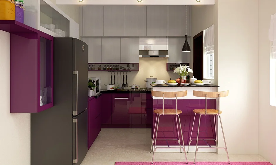 Slim grip profiles on glossy aubergine base units show how handleless kitchen cabinets work without knobs.
