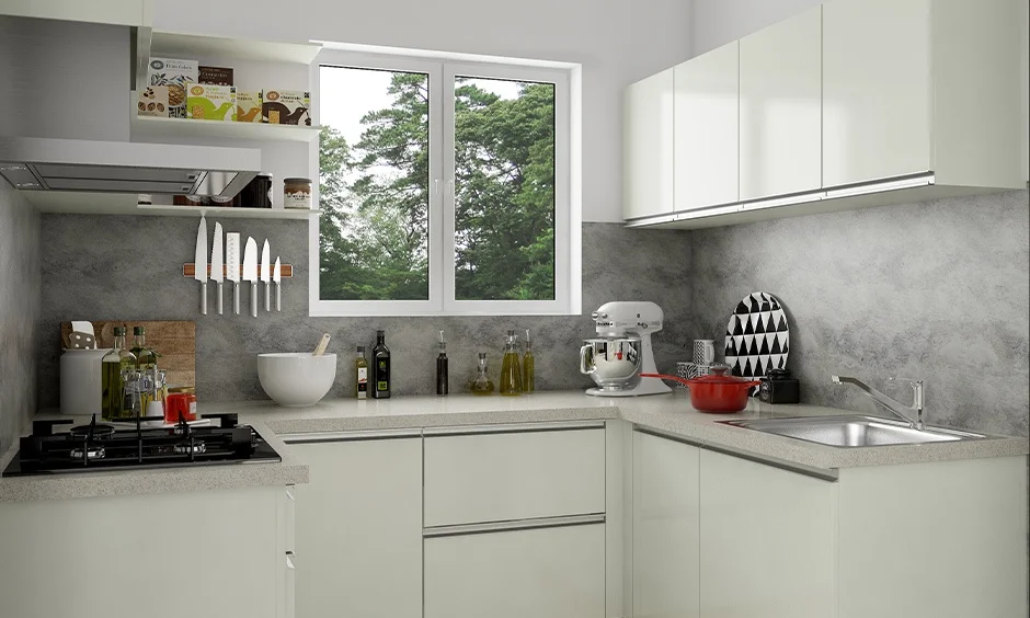 Slim aluminium profiles and flat cream shutters show why handleless kitchen cabinets are easy to maintain.